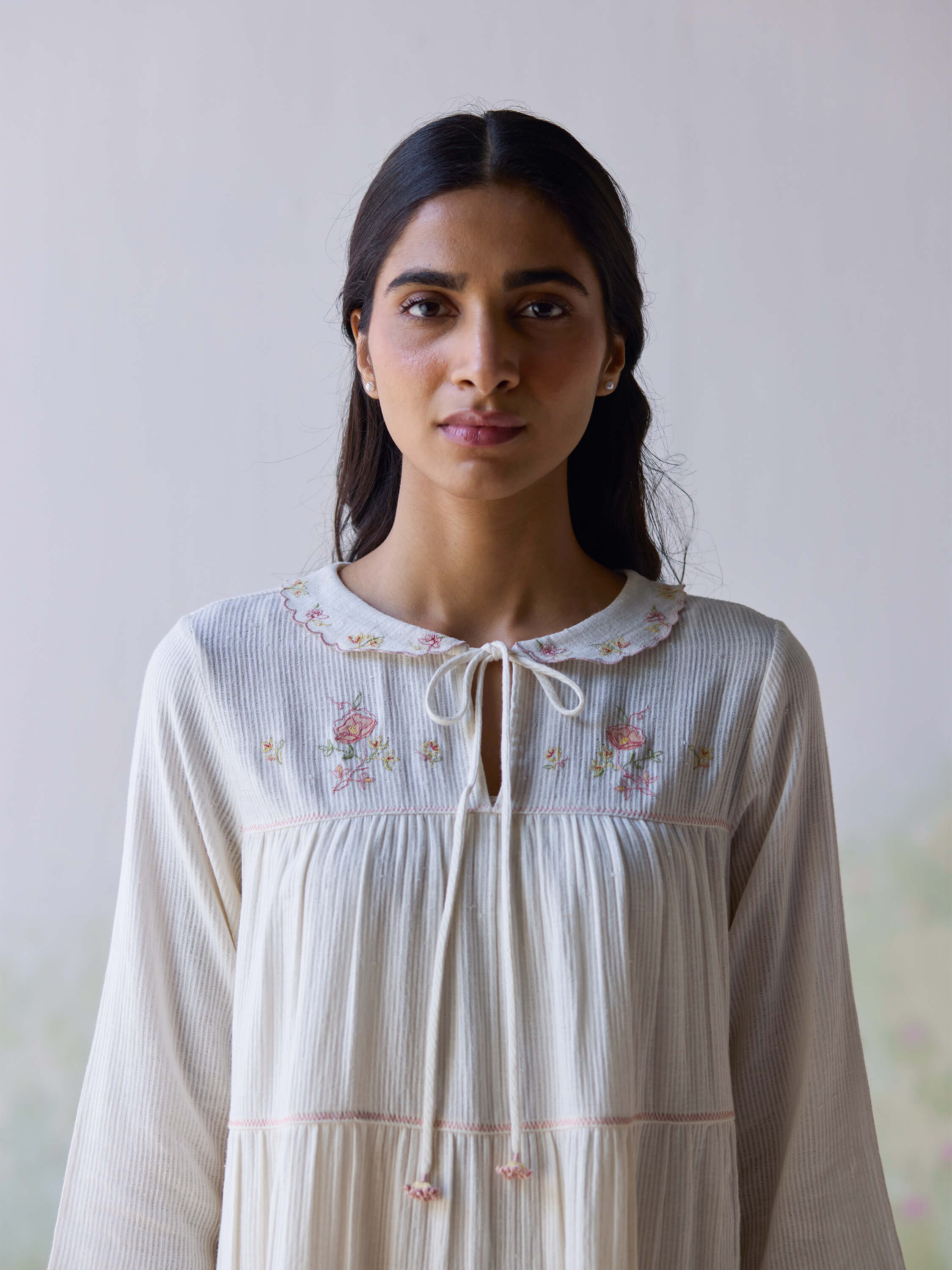 Adagio Tier Midi Dress featuring floral embroidery and a stylish tie neck.