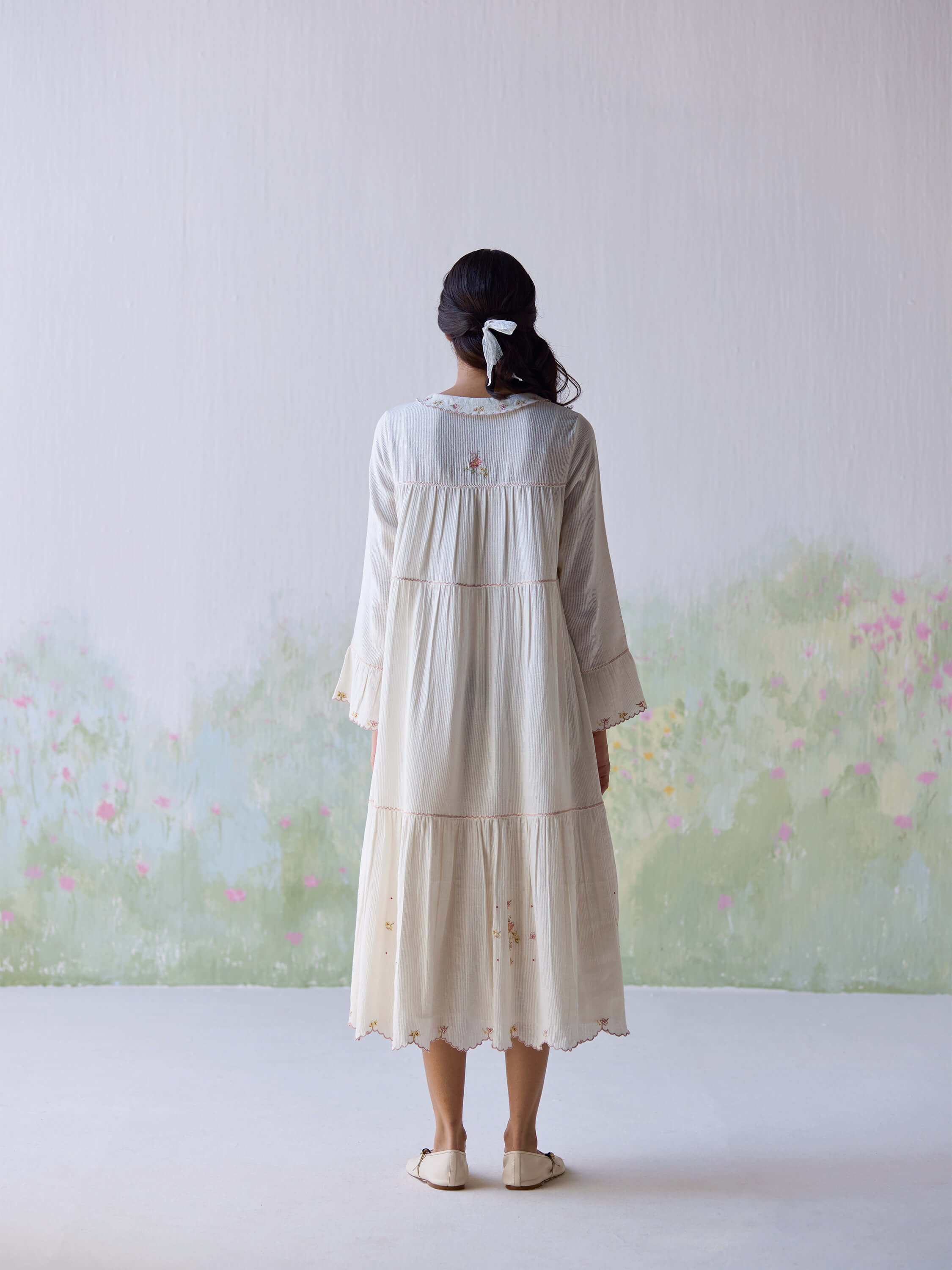 Adagio Tier Midi Dress in cream with floral embroidery, back view.