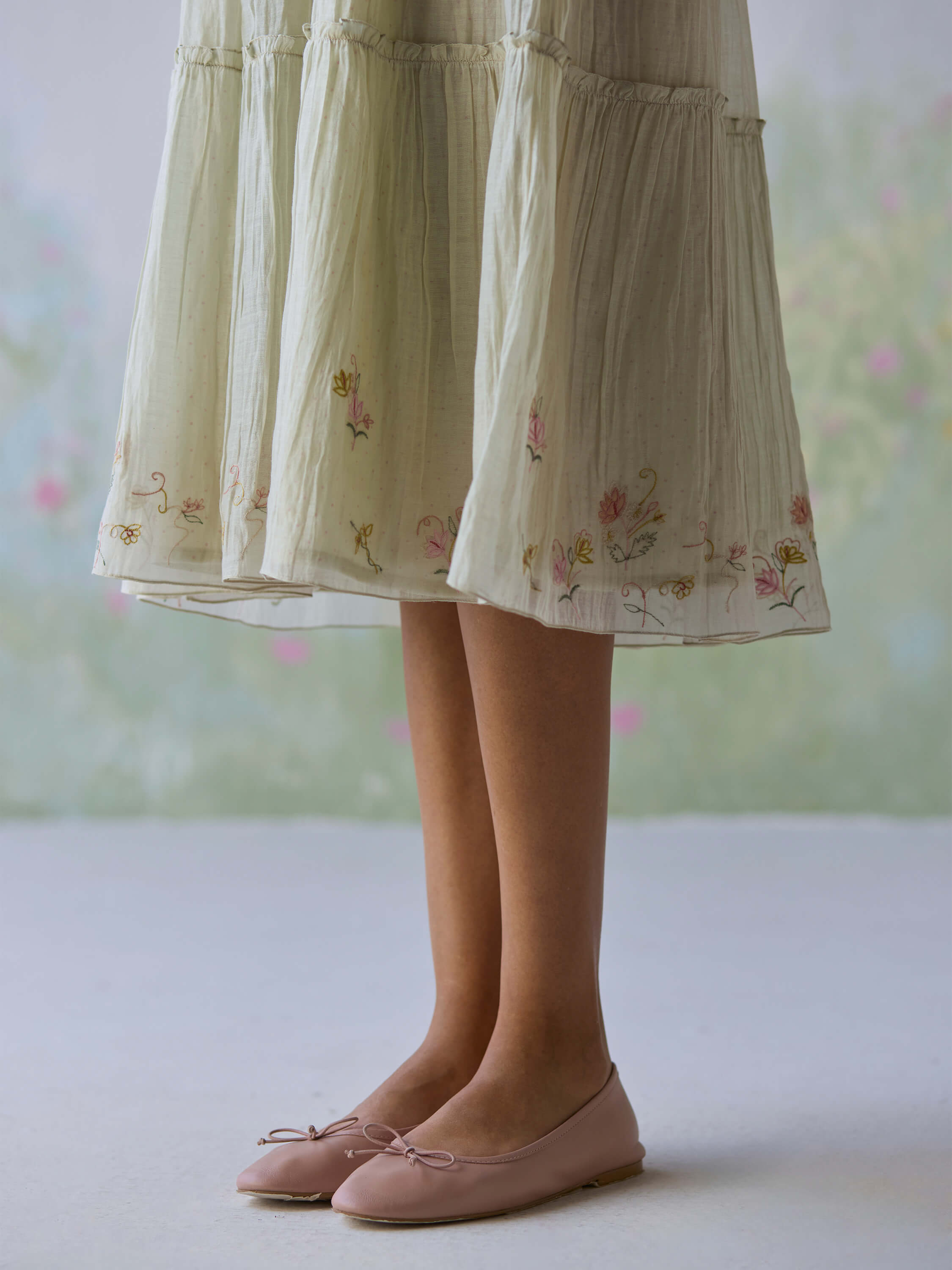 Flutter Fields Midi Dress with floral embroidery and stylish pink flats.