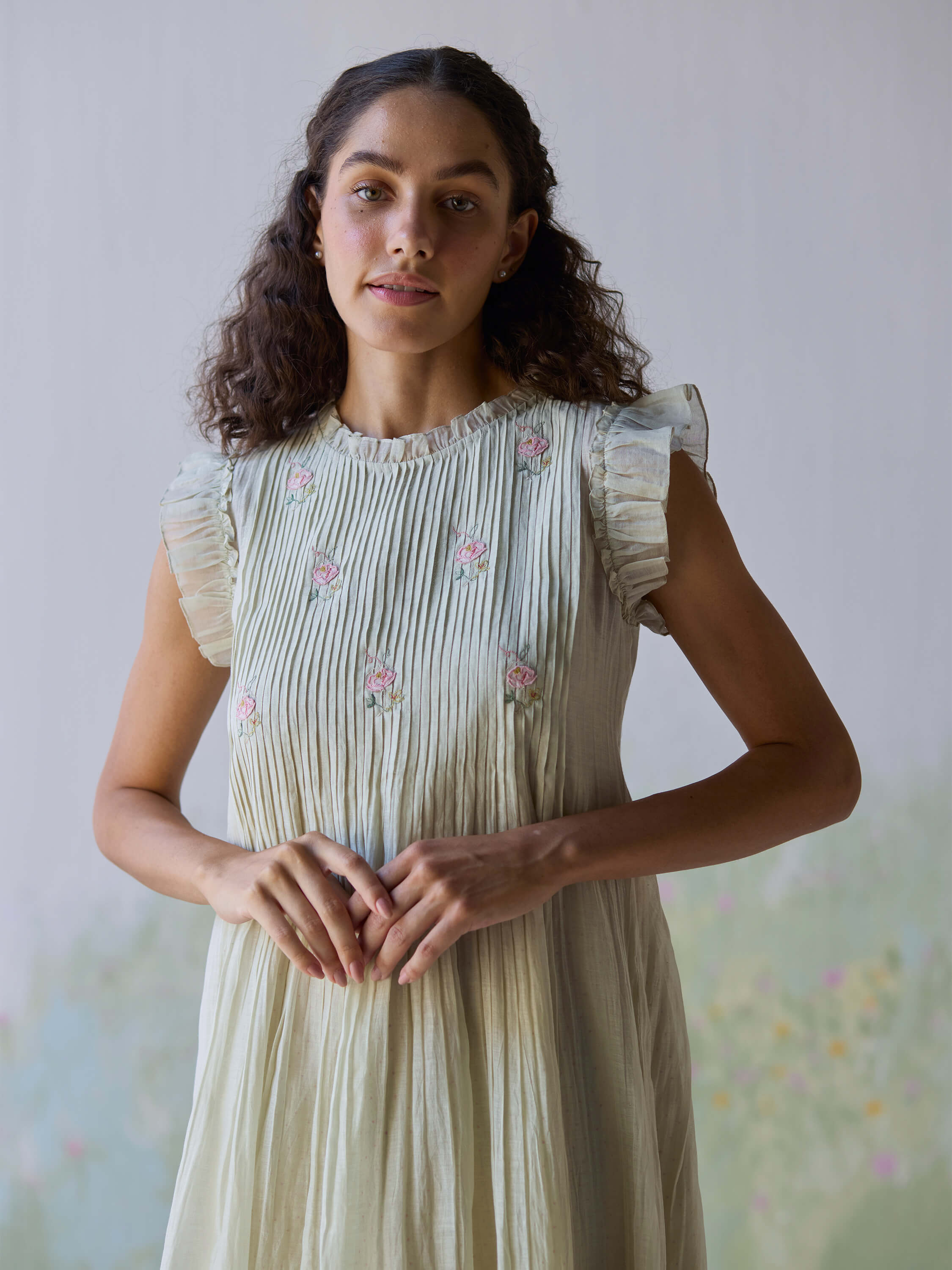 Flutter Fields Midi Dress with floral embroidery and ruffled sleeves.