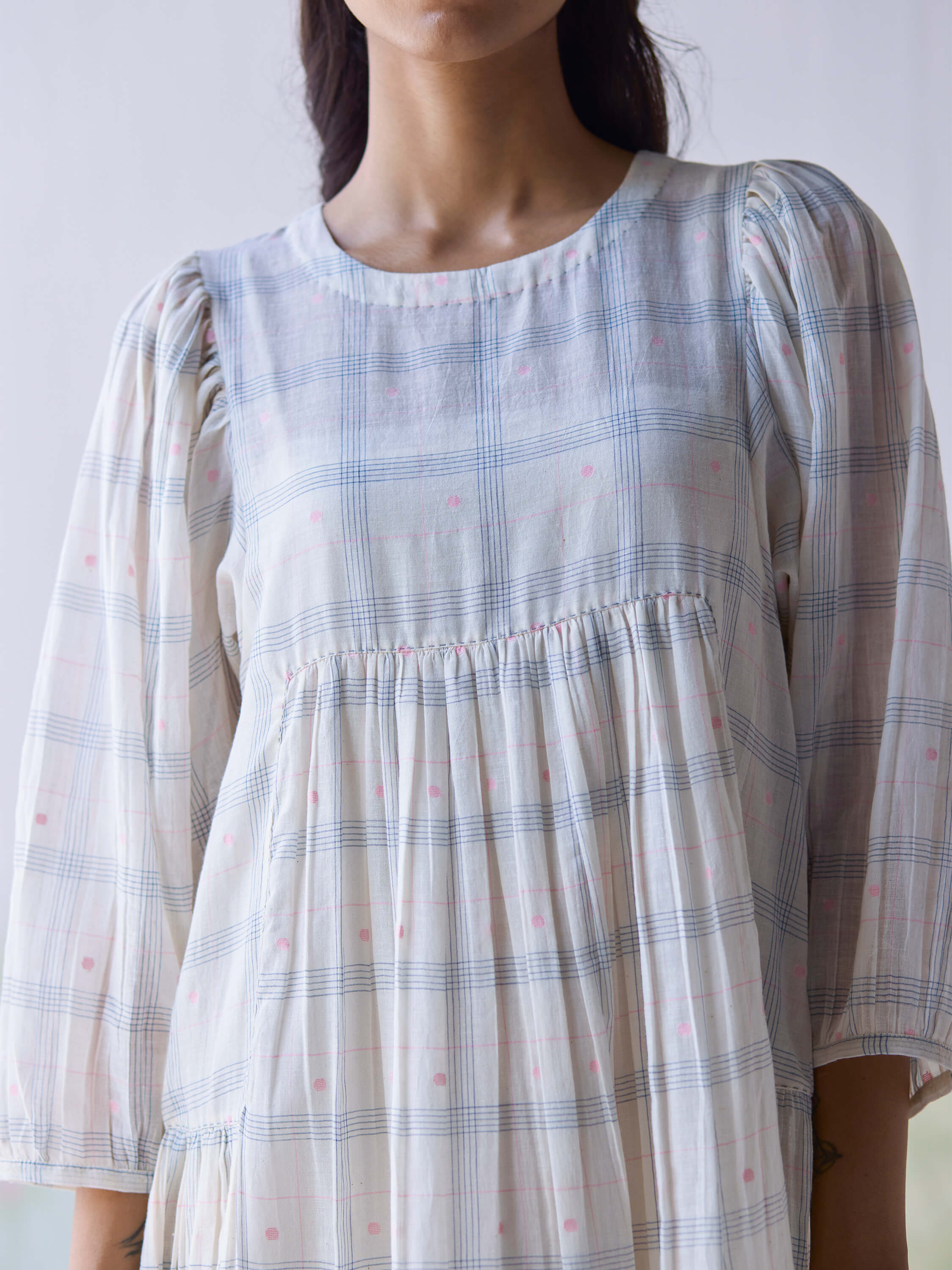Gentle Days Jamdani Dress with pastel checked pattern and puffed sleeves.