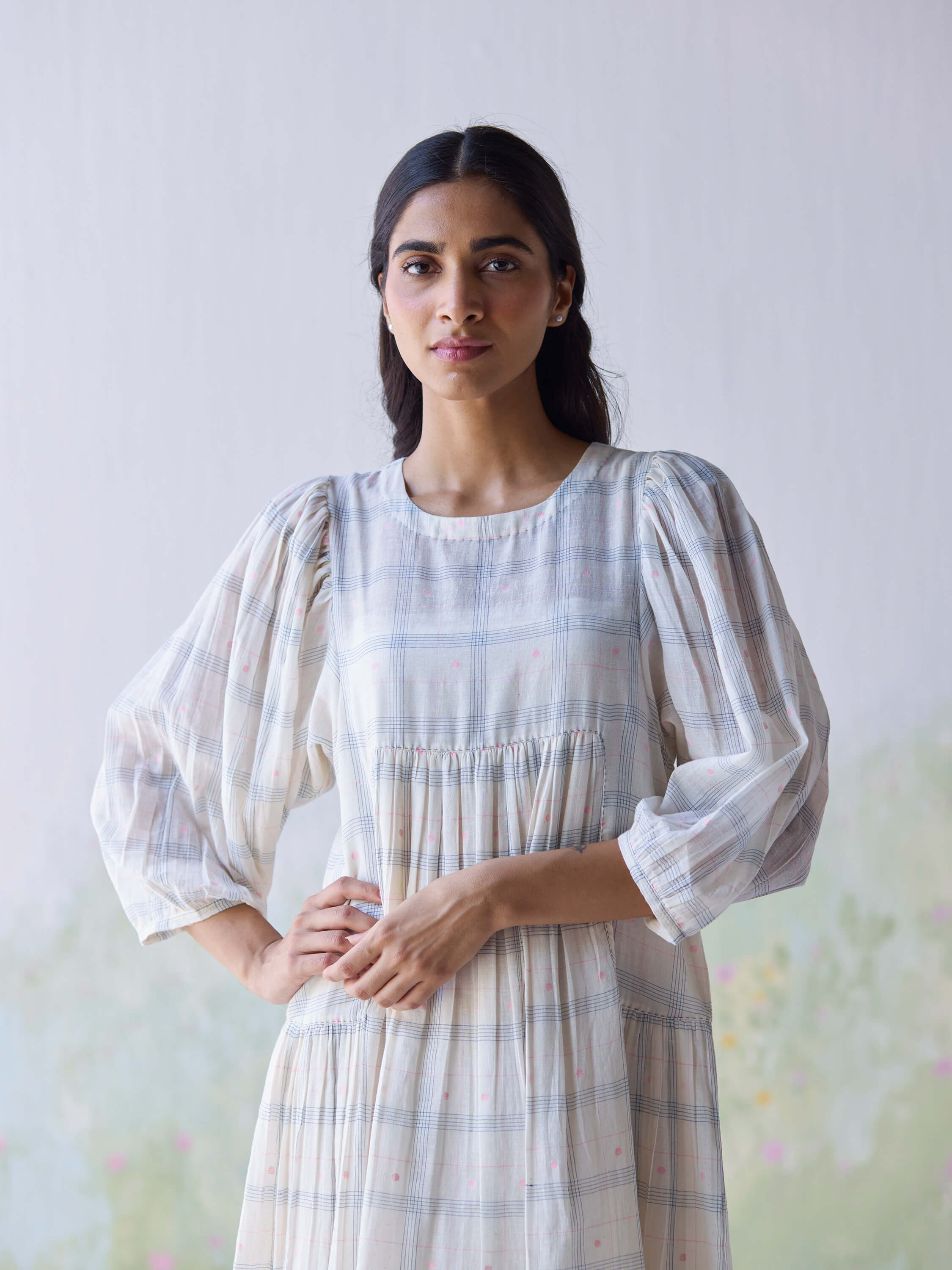 Elegant woman wearing Gentle Days Jamdani Dress with subtle plaid design.