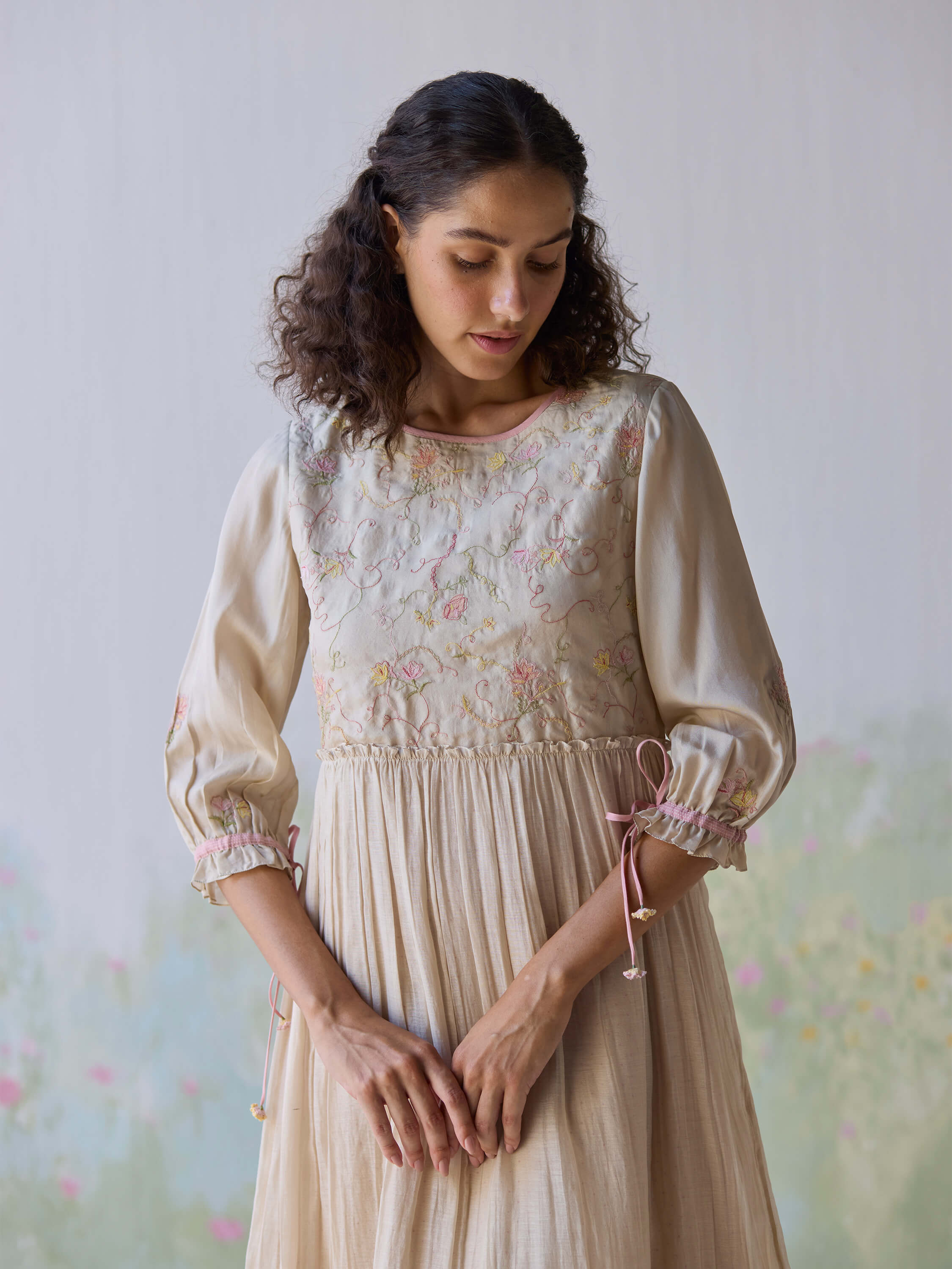 Sonata Embroidered Dress featuring floral embroidery and elegant puff sleeves.