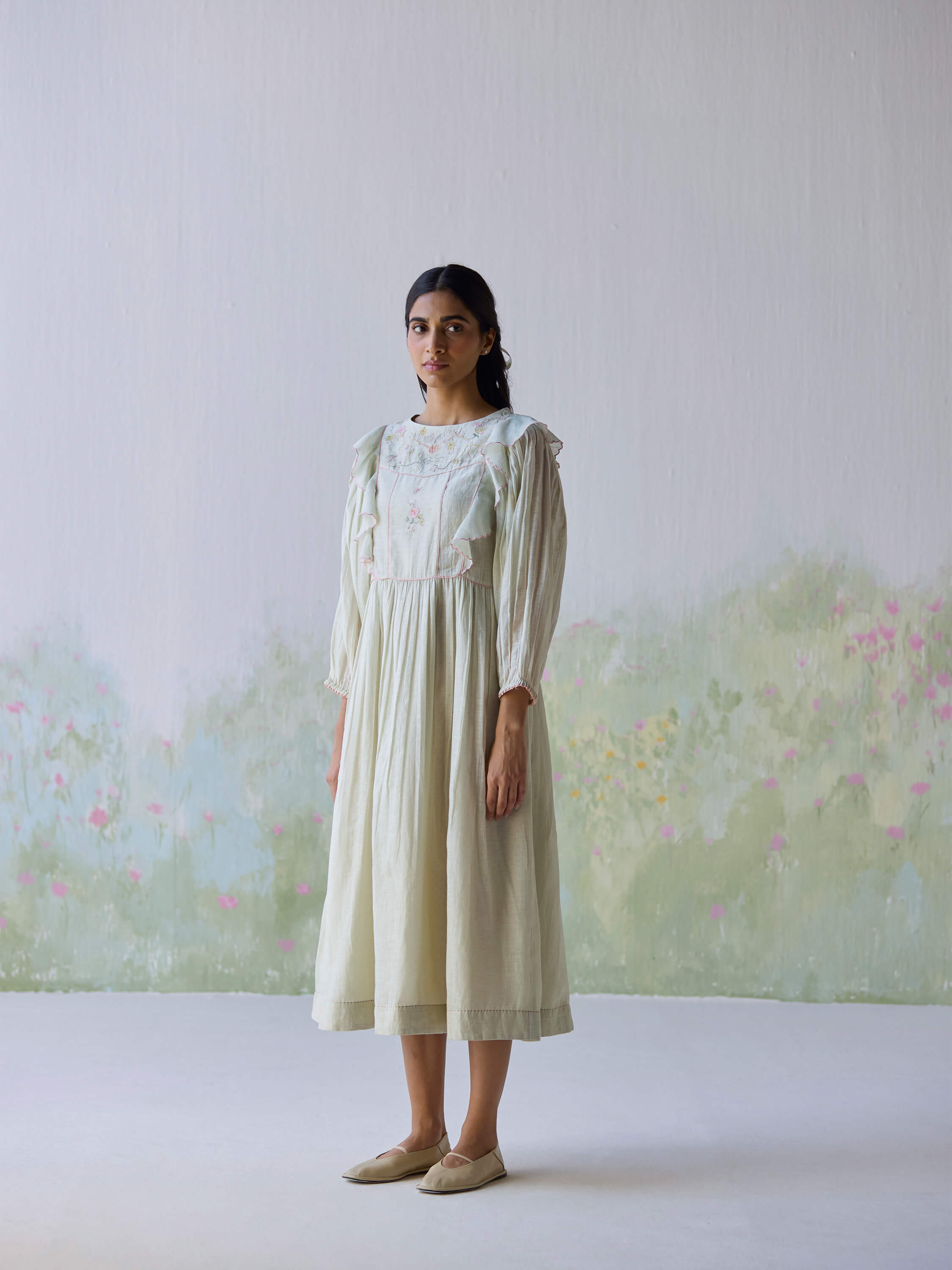 Elegant Sound of Music Midi Dress with floral embroidery and ruffled sleeves.