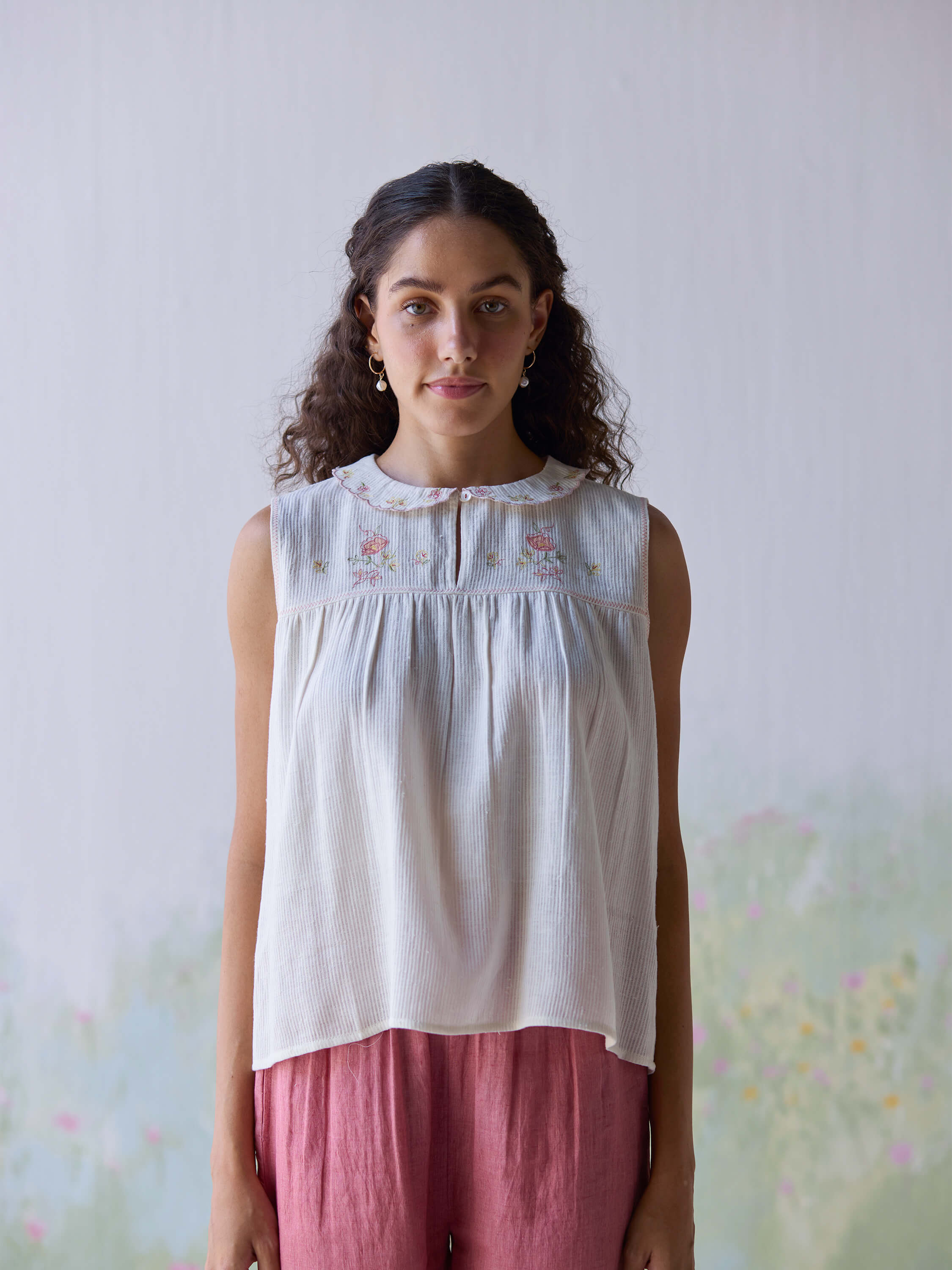 Folk embroidered top with floral design and soft fabric.