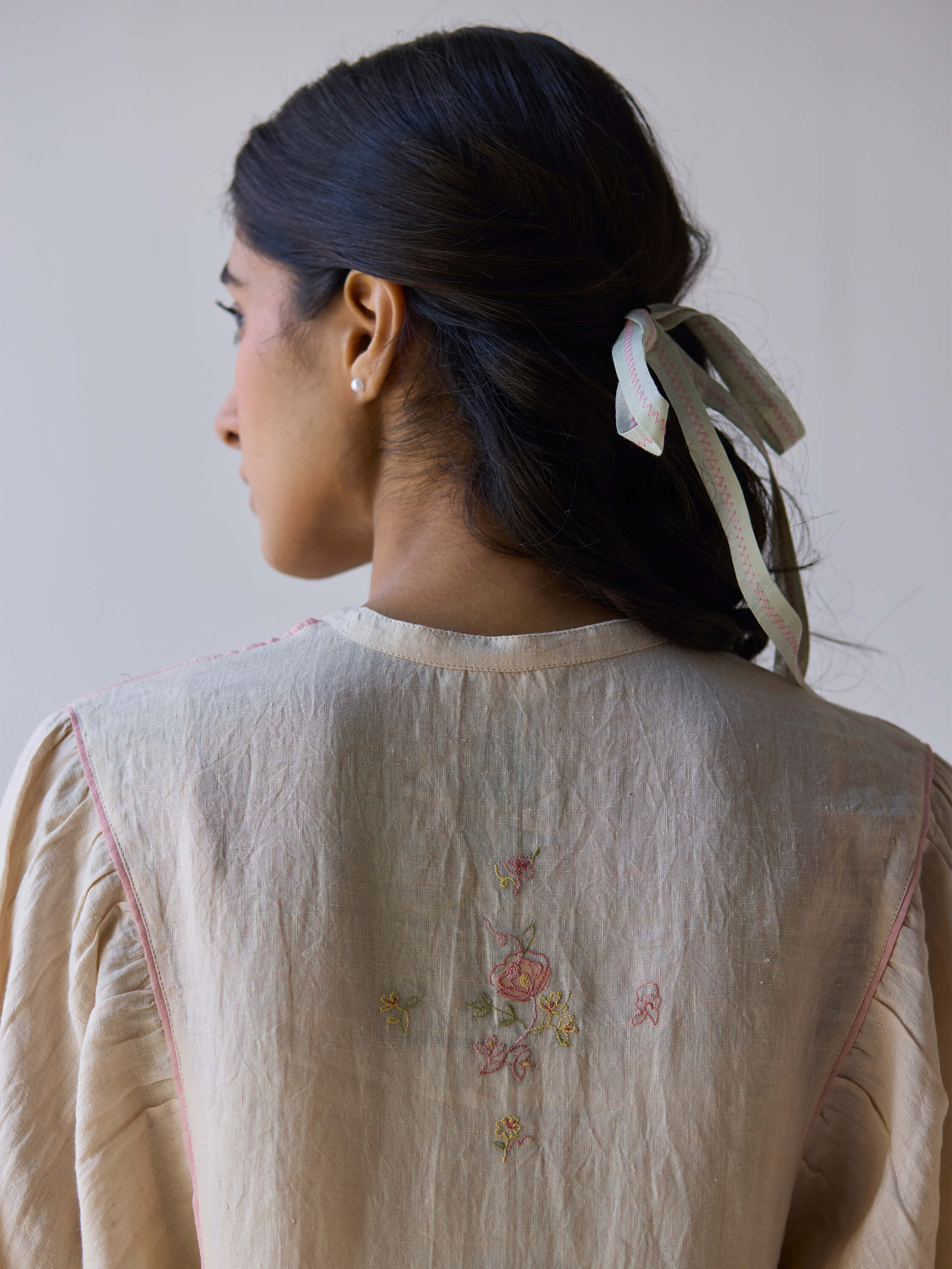 Sweetly embroidered kaftan dress showcasing floral back design and elegant details.