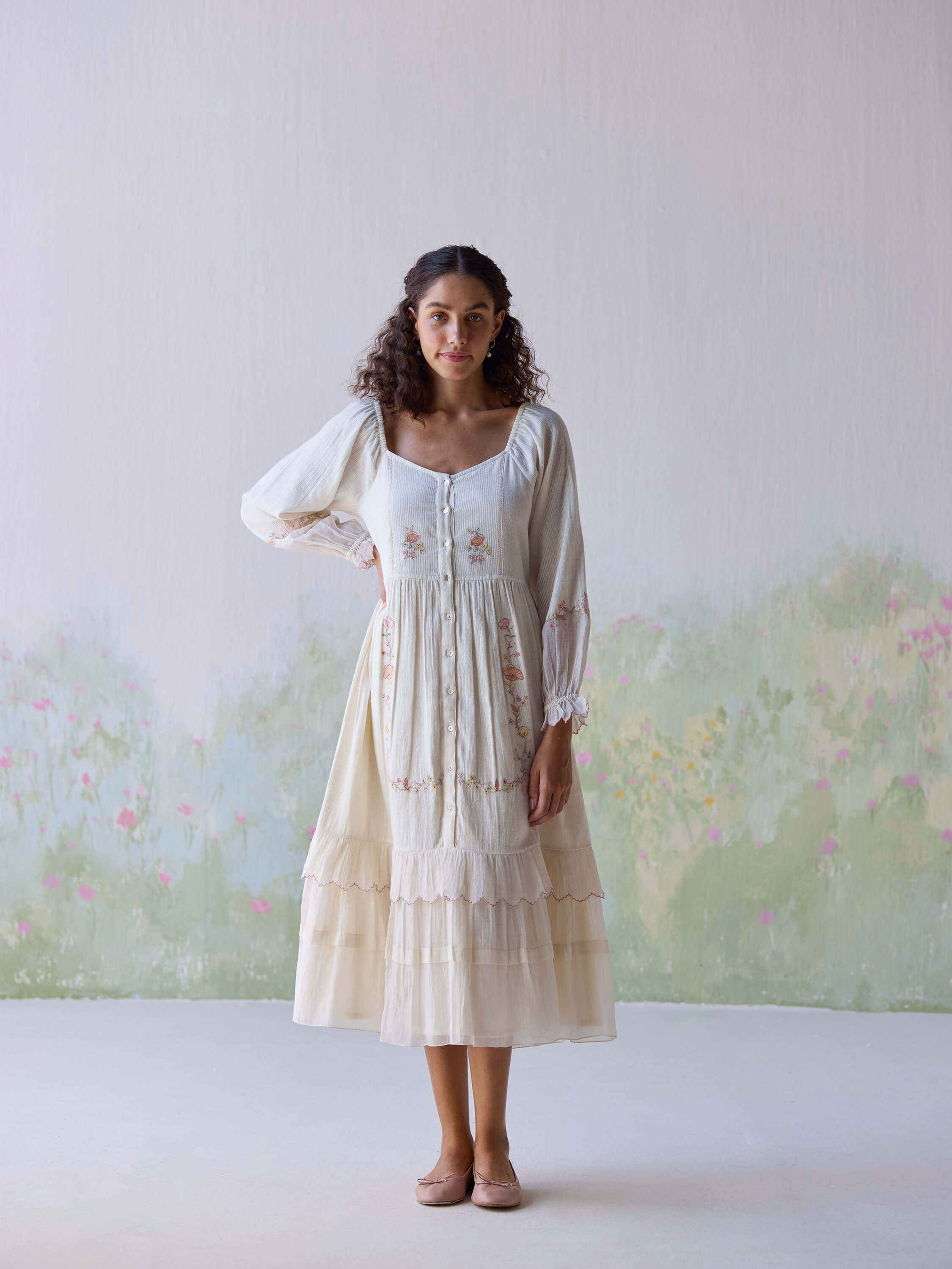 Model wearing elegant Verona Midi Dress with delicate floral embroidery.